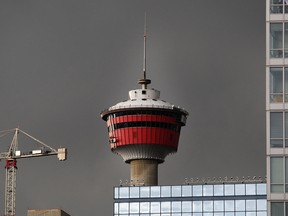 Storm clouds hang above the Calgary Tower on Wednesday, June 24, 2020.