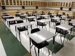 File photo: Empty desks are shown in this photo of at Monsignor Fee Otterson School in Edmonton.