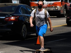 A skater wears face covering as he skates in the Beltline on Tuesday, August 4, 2020.