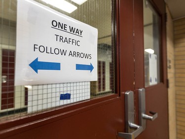 Pictured is a sign showing a one-way traffic corridor to make physical distancing possible in Henry Wise Wood High School on Friday, August 28, 2020. Azin Ghaffari/Postmedia