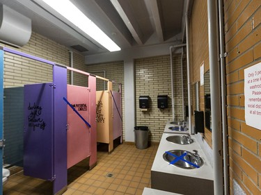 Pictured is a washroom Henry Wise Wood High School where a number of signs have been placed in order to implement physical distancing and every other stall and sink are put out of use on Friday, August 28, 2020. Azin Ghaffari/Postmedia