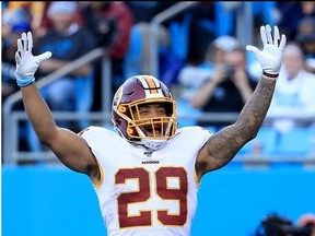 Derrius Guice of the Washington Redskins reacts after running for a touchdown against the Carolina Panthers during their game at Bank of America Stadium on December 01, 2019 in Charlotte, North Carolina.