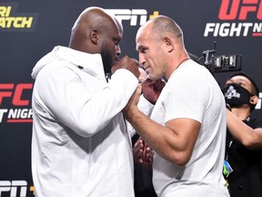 Derrick Lewis (left) and Aleksei Oleinik of Russia face off during the UFC Fight Night weigh-in at UFC APEX on Aug. 7, 2020 in Las Vegas. Chris Unger/Zuffa LLC via Getty Images