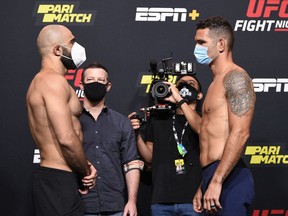 Omari Akhmedov (left) and Chris Weidman face off during the UFC Fight Night weigh-in at UFC APEX on Aug. 7, 2020 in Las Vegas. Chris Unger/Zuffa LLC via Getty Images