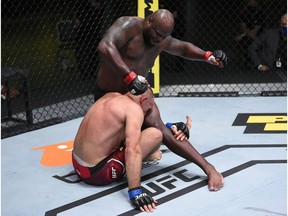 LAS VEGAS, NEVADA - AUGUST 08: In this handout photo provided by UFC, (R-L) Derrick Lewis punches Aleksei Oleinik of Russia in their heavyweight fight during the UFC Fight Night event at UFC APEX on August 08, 2020 in Las Vegas, Nevada.