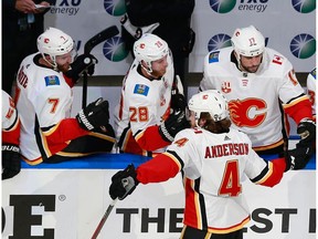 EDMONTON, ALBERTA - AUGUST 11: Rasmus Andersson #4 of the Calgary Flames celebrates his goal against the Dallas Stars at 16:01 of the second period in Game One of the Western Conference First Round during the 2020 NHL Stanley Cup Playoffs at Rogers Place on August 11, 2020 in Edmonton, Alberta, Canada.
