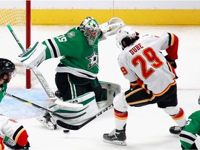 EDMONTON, ALBERTA - AUGUST 11: Dillon Dube #29 scores a first period goal on Anton Khudobin #35 of the Dallas Stars in Game One of the Western Conference First Round during the 2020 NHL Stanley Cup Playoffs at Rogers Place on August 11, 2020 in Edmonton, Alberta, Canada. The Flames defeated the Stars 3-2.