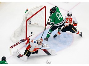 Jamie Benn of the Dallas Stars scores a short-handed goal at 10:13 of the first period against Cam Talbot of the Calgary Flames in Game 5 of the NHL's Western Conference quarterfinals of the 2020 NHL Stanley Cup Playoffs in Edmonton.