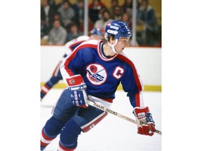 Dale Hawerchuk #10 of the Winnipeg Jets skates against the Boston Bruins at Boston Garden during the 1980s.