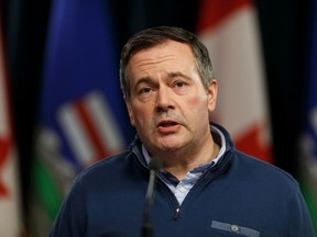 Premier Jason Kenney gives an update on the government's COVID-19 response including further finanical assistance for businesses and families affected by the pandemic at the Alberta Legislature in Edmonton, on Monday, March 23, 2020. Photo by Ian Kucerak/Postmedia