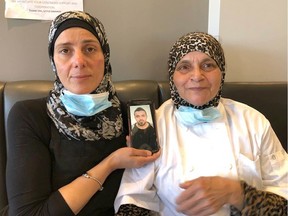 Basitah Rafih (L) owner of Little Lebanon restaurant on 17th Ave. SW in Calgary sits with head chef Seham Chaar on August 5, 2020. Chaar's son Moussa, 33, (in photo) was injured in Tuesday's massive explosion in Beirut, Lebanon. A vigil will be held for Lebanon Wednesday night at 7 p.m. in front of City Hall organized by the Calgary Lebanese Association.