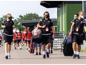 Cavalry FC coaches (L-R) Martin Nash (Assistant Coach), Tommy Wheeldon Jr. (Head Coach/GM) and Jordan Santiago (Goalkeepers Coach) lead the march to  training in Prince Edward Island at the Canadian Premier League Island Games. David Chant photo/CPL