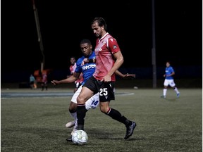 Canadian Premier League - FC Edmonton vs Cavalry FC - Charlottetown, PEI- Aug 20, 2020]. Cavalry FC #25 Robert Boskovic defending the ball.