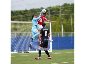 Cavalry FC's Marcus Haber goes up for a header but crashes with Pacific FC goalkeeper Callum Irving in a 2-1 loss at The Island Games in Charlottetown, P.E.I.