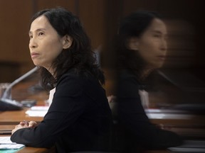 Chief Public Health Officer Dr. Theresa Tam is reflected in a television during a news conference in Ottawa, Friday, Aug. 14, 2020.