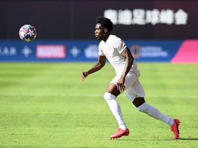 Bayern Munich's midfielder Davies Alphonso runs with the ball during the friendly football match between German Bundesliga's FCBayern Munich and French Ligue 1 Olympique de Marseille (OM) on July 31, 2020, in preparation of the upcoming 2020-2021 season.