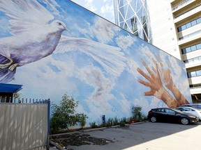 Doug Driediger's mural Giving Wings to the Dream on the old CUPS building on 7th Avenue on Tuesday, Aug. 11, 2020.