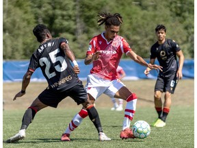 Cavalry FC Mohamed Farsi takes on Valour FC Solomon Antwi on Sunday, August 16, 2020, during Canadian Premier League Island Games in Charlottetown, Prince Edward Island. Cavalry won 2-0 and Farsi was named Man of the Match. CPL/Chant Photography