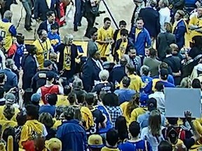 An altercation between a sheriff's deputy and Raptors president Masai Ujiri is shown in this screengrab.