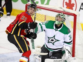 The Calgary Flames’ Garnet Hathaway attempts to redirect a puck past Dallas Stars goalie Ben Bishop at the Scotiabank Saddledome in Calgary on March 27, 2019. Al Charest/Postmedia