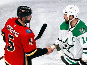 Flames captain Mark Giordano shakes hands with Dallas Stars captain Jamie Benn following Game 6 of the Western Conference first round on Aug. 20, 2020, in Edmonton.