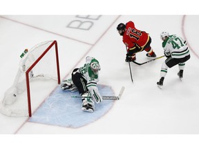 Calgary Flames forward Tobias Rieder (No. 16) scores a short-handed goal against Dallas Stars goaltender Anton Khudobin (No. 35) in front of right-winger Alexander Radulov (47) during the third period in Game 4 of the first round of the 2020 Stanley Cup Playoffs at Rogers Place.