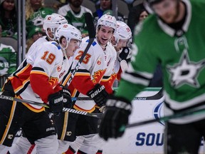 The Calgary Flames’ Matthew Tkachuk (19) and Sean Monahan (23) celebrate a goal scored by Tkachuk against the Dallas Stars at the American Airlines Center in Dallas on Dec. 22, 2019. Jerome Miron/USA TODAY Sports