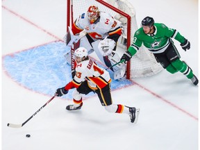 Aug 13, 2020; Edmonton, Alberta, CAN; Calgary Flames left wing Johnny Gaudreau (13) controls the puck against the Dallas Stars during the first period in game two of the first round of the 2020 Stanley Cup Playoffs at Rogers Place. Mandatory Credit: Sergei Belski-USA TODAY Sports ORG XMIT: USATSI-429687