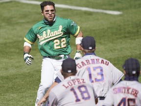 Ramon Laureano of the Oakland Athletics charges towards the Houston Astros dugout after he was hit by a pitch in the bottom of the seventh inning at RingCentral Coliseum on August 9, 2020 in Oakland.