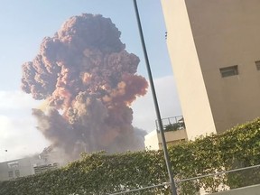 Smoke rises after an explosion in Beirut, Lebanon August 4, 2020, in this picture obtained from a social media video.