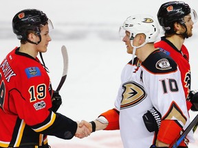 The Calgary Flames’ Matthew Tkachuk and Corey Perry, then a member of the Anaheim Ducks, Shake after Game 4 of their 2017 Western Conference quarter-final series at the Saddledome. The Ducks won 3-1 to sweep the best-of-seven series. Al Charest/Postmedia