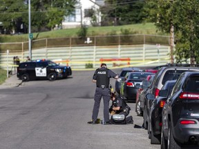 Members of the Calgary Police Service investigate the scene of a suspected stabbing that took place in 5500 block of 2 St. S.W. on Thursday, August 13, 2020.