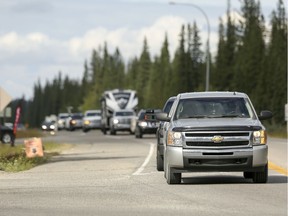 FILE - Traffic flows through the intersections of Cowboy Trail (Highway 22), Burnside Drive and White Avenue in Bragg Creek at around 5 p.m. before the long weekend on Friday, August 4, 2017