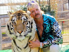 This undated file photo courtesy of Netflix shows Joseph "Joe Exotic" Maldonado-Passage with one of his tigers.