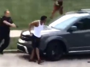 Video circulating on social media shows Kenosha, Wis., police following Jacob Blake to his car before he was shot multiple times in the back.