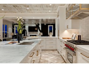 The chef's kitchen in a Silverhorn estate home by McKinley Masters.