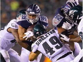 PHILADELPHIA, PA - AUGUST 08: Alex Barnes #39 of the Tennessee Titans runs the ball against Alex Singleton #49 of the Philadelphia Eagles in the fourth quarter preseason game at Lincoln Financial Field on August 8, 2019 in Philadelphia, Pennsylvania. The Titans defeated the Eagles 27-10.