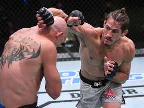 Niko Price punches Donald Cerrone in their welterweight bout during UFC Fight Night at UFC APEX on Sept. 19, 2020 in Las Vegas. Zuffa/LLC via Getty Images