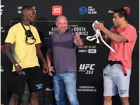 ABU DHABI, UNITED ARAB EMIRATES - SEPTEMBER 25: In this handout image provided by UFC,(L-R) Opponents Israel Adesanya of Nigeria and Paulo Costa of Brazil face off during the UFC 253 weigh-in on September 25, 2020 at Flash Forum on UFC Fight Island, Abu Dhabi, United Arab Emirates.