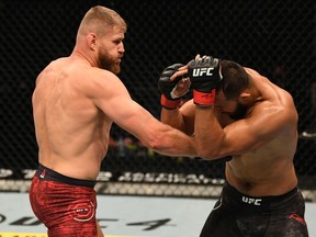 Jan Blachowicz punches Dominick Reyes during their light-heavyweight bout at UFC 253 in Abu Dhabi. Zuffa/Josh Hedges/Zuffa LLC via Getty Images