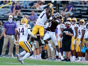 BATON ROUGE, LOUISIANA - SEPTEMBER 26: Eli Ricks #1 of the LSU Tigers intercepts a pass over JaVonta Payton #0 of the Mississippi State Bulldogs during a NCAA football game at Tiger Stadium on September 26, 2020 in Baton Rouge, Louisiana.