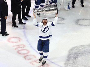 Brayden Point #21 of the Tampa Bay Lightning skates with the Stanley Cup following the series-winning victory over the Dallas Stars in Game Six of the 2020 NHL Stanley Cup Final at Rogers Place on September 28, 2020 in Edmonton, Alberta, Canada.