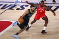 Celtics forward Jayson Tatum dribbles the ball against Raptors forward Rondae Hollis-Jefferson (4) during Game 5 on Monday.