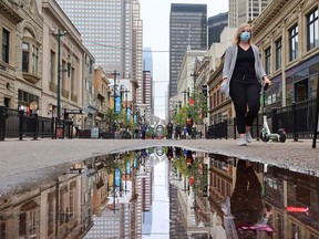 Calgarians walk in downtown Calgary on a cool day, Monday, Sept. 14, 2020.