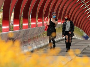 Calgarians wear masks as they cross the Peace Bridge into Eau Claire on Wednesday, September 16, 2020.