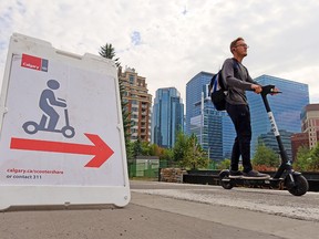 Calgarians ride e-scooters in Eau Claire on Wednesday, September 16, 2020. The City of Calgary is asking for online input as the shared e-scooter pilot program comes to an end.