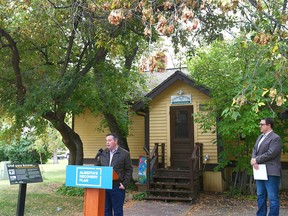 Alberta Premier Jason Kenney (L) and Parks Minister Jason Nixon are pictured at Fish Creek Park in front of the Friends of Fish Creek building in Calgary during a press conference on Tuesday, September 15, 2020.