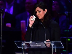Kobe Bryant's wife Vanessa Bryant wipes away tears as she speaks during the "Celebration of Life for Kobe and Gianna Bryant" service at Staples Center in Los Angeles, Feb. 24, 2020.