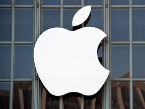 In this file photo taken on September 7, 2016 the Apple logo is seen on the outside of Bill Graham Civic Auditorium before the start of an event in San Francisco, California.