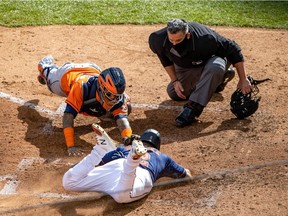 Houston Astros catcher Martin Maldonado tags out the Minnesota Twins’ Luis Arraez at home plate in the fifth inning at Target Field in Minneapolis in Game 2 of their American League Wild Card Series on Sept. 30, 2020. Jesse Johnson/USA TODAY Sports